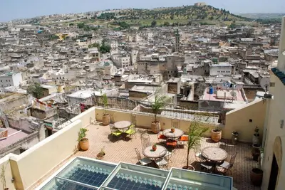 a view of a city from the roof of a building at Riad Le Patio De Fes in Fès