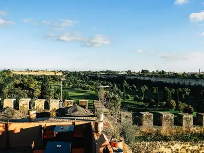 a view of the city of matera from the roof of a building at Riad Golf Stinia 1 in Meknès