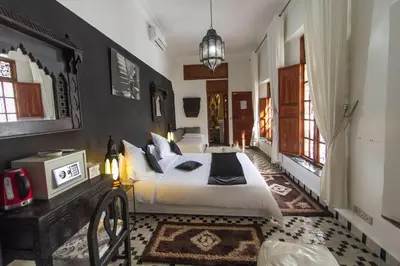 a bedroom with a large bed in a room at Riad 53 Fes - Luxury Oasis in Fès