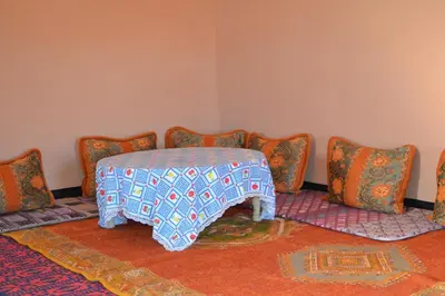 a room with a table and chairs in a room at GITE D'etape SIDI FLAH in Sidi Flah