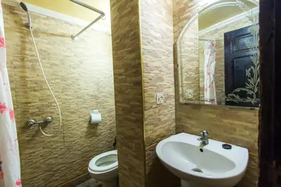 a bathroom with a sink and a toilet and a mirror at Riad Anass Al Ouali in Fès