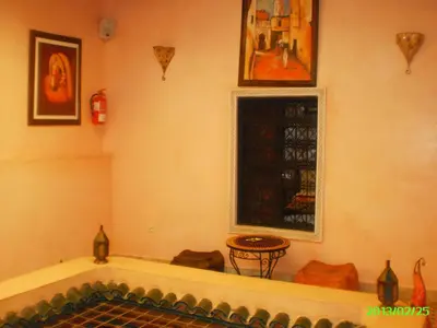 a room with a table and a window and some vases at Riad Anass Al Ouali in Fès