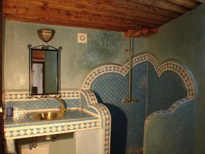 a bathroom with a sink and a mirror at Riad Sheryne Fes in Fès