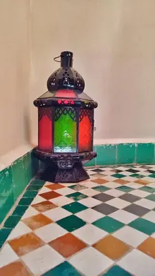 a lantern sitting on a tiled floor in a room at Riad Fes Touria Palace in Fès