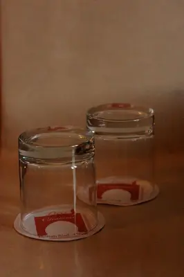 two glass jars sitting on top of a table at Dar Chamaa in Ouarzazate