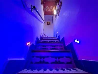 a set of stairs with blue and purple lights at Dar Mfaddel in Fès