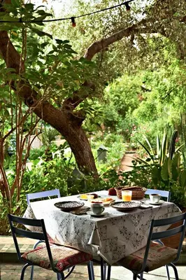a table with plates of food on top of it at Riad Jardin Des Biehn in Fès