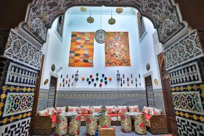 a room with a table in the middle of a building at Dar Fes Tresor in Fès