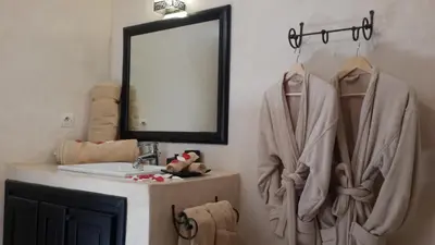 a bathroom with a sink and a mirror at Kasbah ATFEL in Ourika