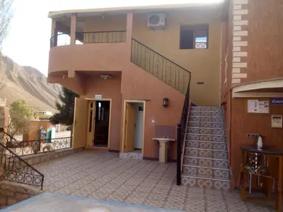 a building with a staircase and a stair case at Hotel Baddou in Tamtetoucht