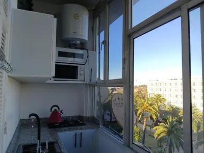 a kitchen with a microwave and a window at Ryan S3 in Fès