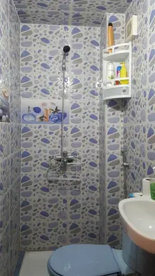 a bathroom with a shower with a toilet and a sink at Ryan S3 in Fès