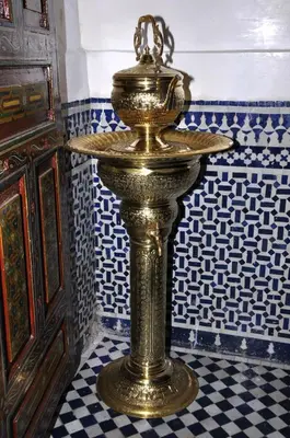 a gold trophy on a tiled floor in a room at Riad Khouloud in Fès