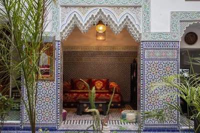a living room with a couch in a room at Riad Naila & suite in Fès