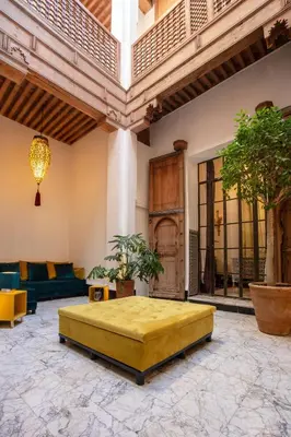 a large room with a large bed in the middle at La Maison Maure in Fès