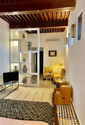 a living room with a couch and a table at La Maison Maure in Fès