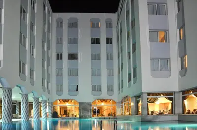 an exterior view of a hotel with a swimming pool at Zalagh Parc Palace in Fès