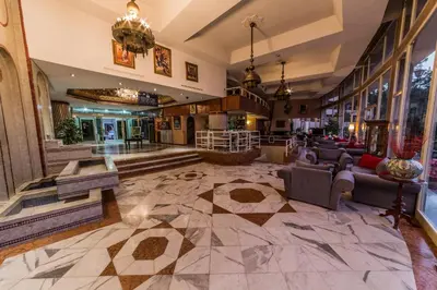 a lobby of a hotel with couches and tables at Menzeh Zalagh City Center in Fès