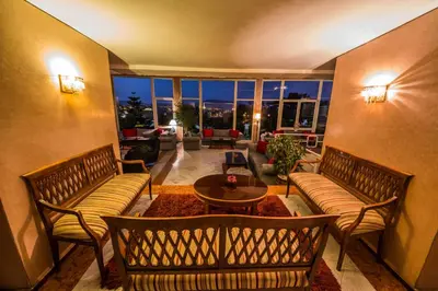 a living room with two couches and a table at Menzeh Zalagh City Center in Fès