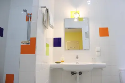 a bathroom with a sink and a mirror at Auberge Tinit in Er Rachidia