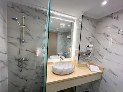 a bathroom with a sink and a shower at Menzeh Zalagh 2Boutique Hôtel & Sky in Fès