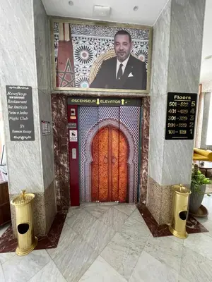 a door with a picture of a man on it at Menzeh Zalagh 2Boutique Hôtel & Sky in Fès