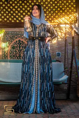 a woman in a dress posing for a picture at Riad Farah in Fès