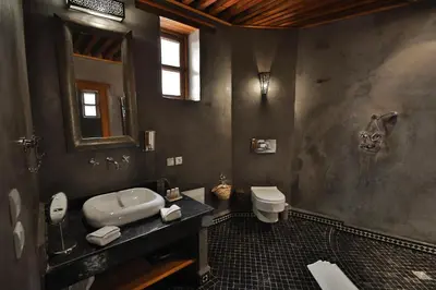 a bathroom with a sink and a toilet at Riad Layla in Fès