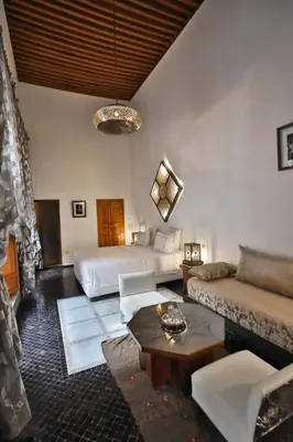 a living room with two beds and a couch at Riad Layla in Fès