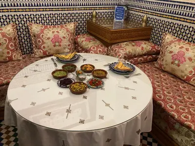 a table with plates of food on top of a couch at Dar D'or Fes in Fès