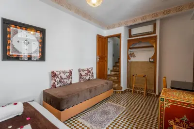 a bedroom with a bed in a room at Dar D'or Fes in Fès