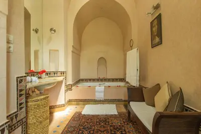a living room with a couch and a table at Villa Akhdar 18 in Ben Larbi