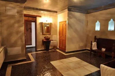 a room with a bathroom with a tub and a sink at Riad Said in Fès