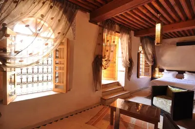 a bedroom with a bed and a window at Riad Said in Fès