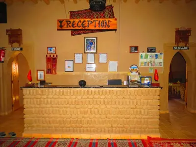 a bar made out of legos in a restaurant at Hôtel Riad Tadarte Familier in Merzouga