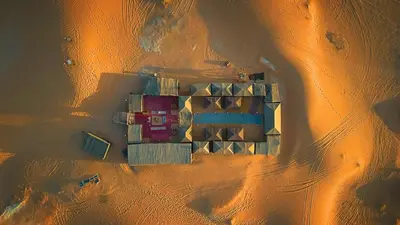 an aerial view of a building in the desert at Auberge La Source in Merzouga