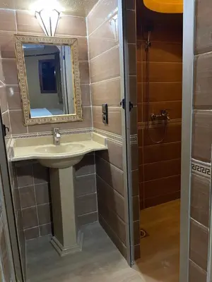 a bathroom with a sink and a mirror at Sunny Place apartments in Merzouga