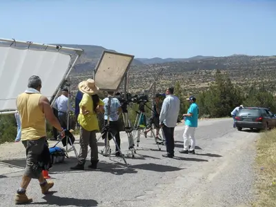 a group of people standing on the side of a road at Tigmi Dar Samy in Bine el Ouidane