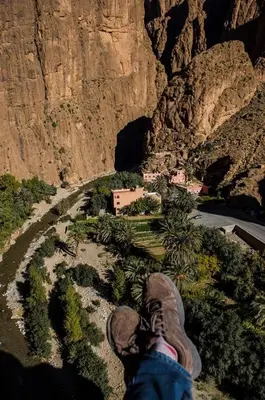 a person standing on top of a model of a mountain at Riad iriki in Tinerhir