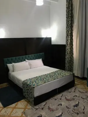 a bedroom with a bed in a room with at Maison Duffal in Azrou
