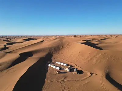 an aerial view of a village in the desert at Camp atlantic chegaga in Mhamid