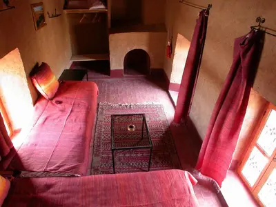 an overhead view of a room with a bed and a table at Gite Elkhorbat in Tinejdad