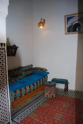 a living room with a couch and a table at Riyad Al Atik in Fès