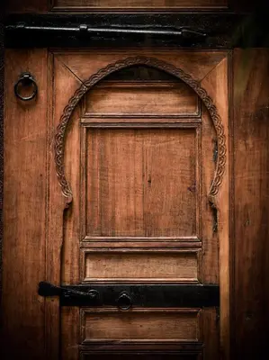 an old wooden door with an ornate handle at Riyad Al Atik in Fès