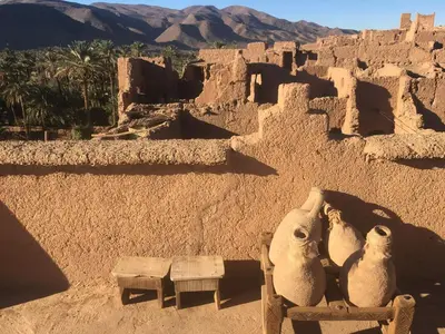 a view of a desert with a building and an elephant statue at Kasbah Maktob Tamnougalt in Agdz