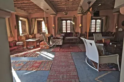 a large living room with a couch and chairs at Sawadi Ecolodge in Skoura