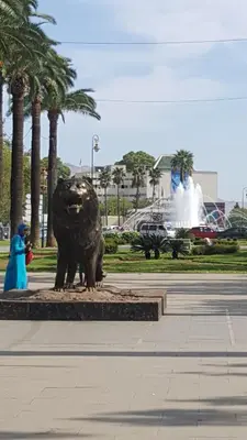 a statue of a bear in a park with palm trees at Ryan 3 in Fès