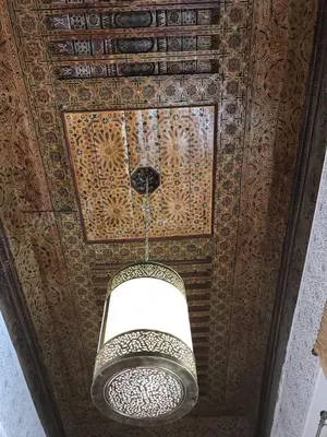 a chandelier hanging from the ceiling of a building at Riad jasmins & Spa in Fès