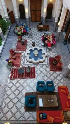 an overhead view of a lobby with tables and chairs at Riad jasmins & Spa in Fès
