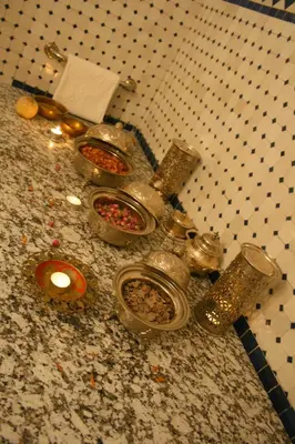 a counter top with several containers of food on it at Riad Lalla Fatima in Fès